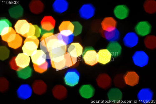 Image of Blurred colorful lights over black