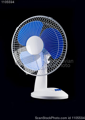 Image of Modern desk cooling fan over black 