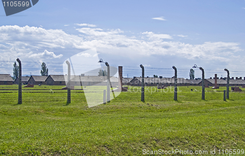 Image of Wire fence and barracks in Birkenau concentration camp