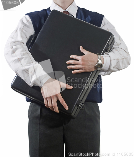 Image of Businessman clasping case to breast