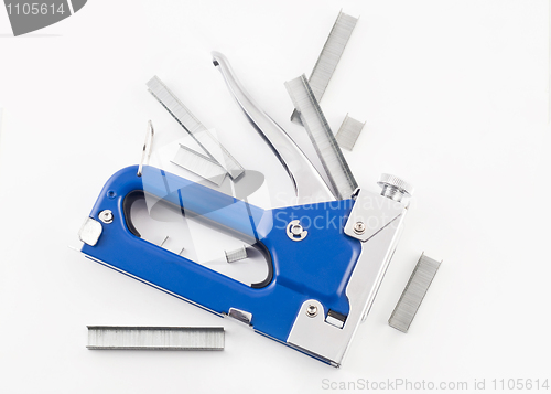 Image of Blue staple gun with staples isolated over white 