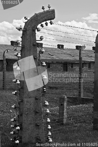 Image of Wire fence and barracks in Auschwitz - Birkenau concentration ca