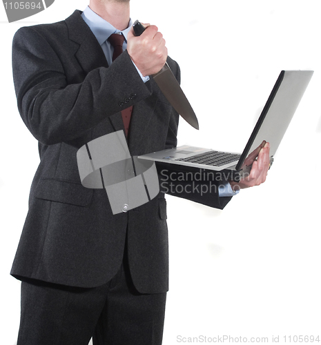 Image of Angry Businessman stabbing notebook with a knife