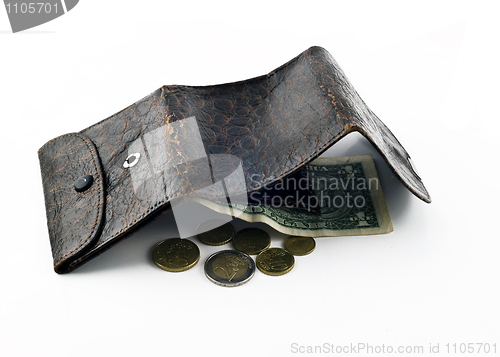 Image of Opened frayed leather wallet with one dollar bond and change