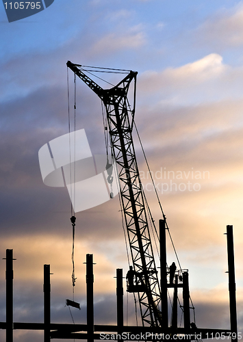 Image of Builders in back lighting