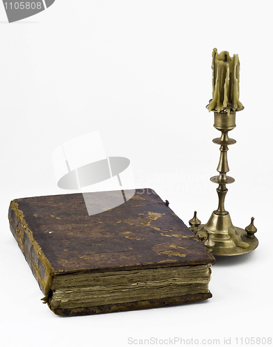 Image of Candlestick and a book