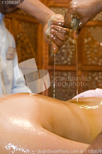 Image of indian ayurvedic oil body massage