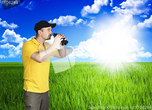 Image of man and green grass field 