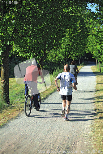 Image of people run in a park