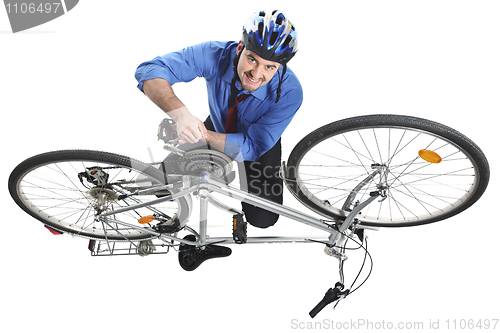 Image of man repai his bicycle