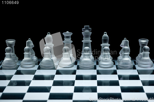 Image of Macro shot of glass chess set against a black background
