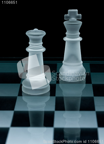 Image of Macro shot of glass chess pieces against a black background