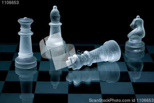 Image of Macro shot of glass chess pieces against a black background