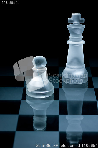 Image of Macro shot of glass chess pieces against a black background