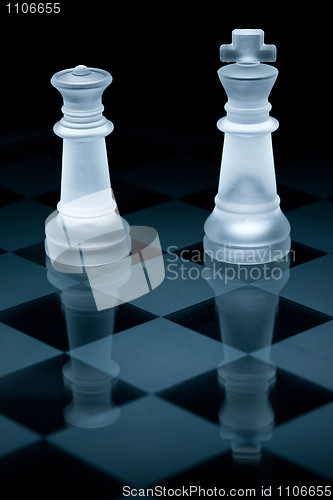 Image of Macro shot of glass chess pieces against a black background