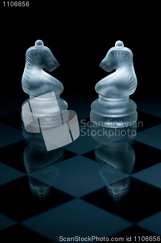 Image of Macro shot of glass chess pieces against a black background