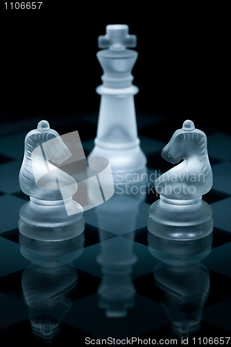 Image of Macro shot of glass chess pieces against a black background