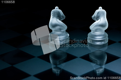 Image of Macro shot of glass chess pieces against a black background