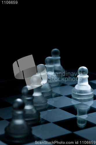 Image of Macro shot of glass chess pieces against a black background