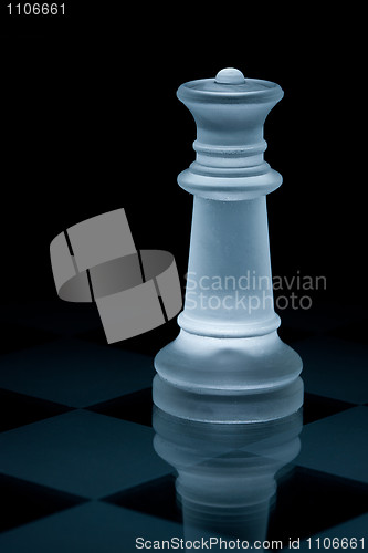 Image of Macro shot of glass chess queen against a black background