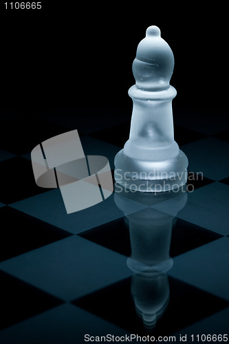 Image of Macro shot of glass chess bishop against a black background