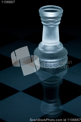 Image of Macro shot of glass chess rook against a black background