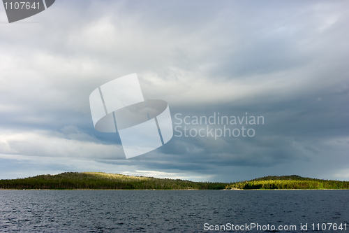 Image of Island in the sea shined with sun beams