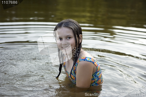 Image of The girl bathes in lake