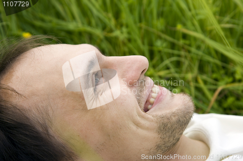 Image of The man lies on a grass