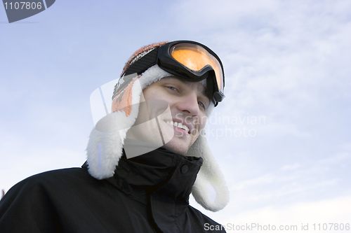 Image of young man in ski glasses and a winter cap