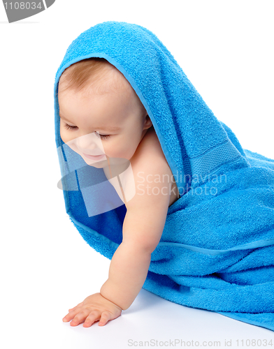 Image of Cute child wrapped in blue towel