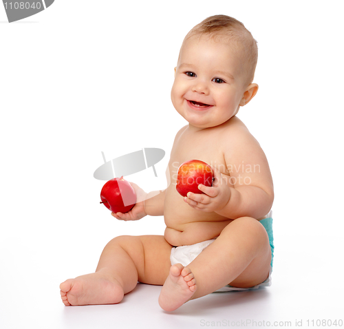 Image of Little child with apple