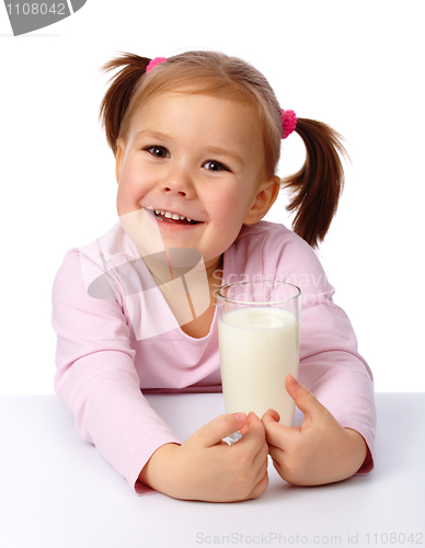 Image of Little girl with a glass of milk