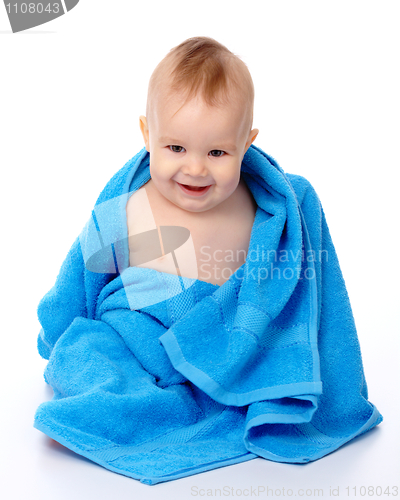 Image of Cute child wrapped in blue towel