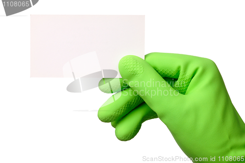 Image of Hand in green glove showing business card