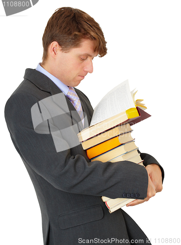 Image of Man reading book in library