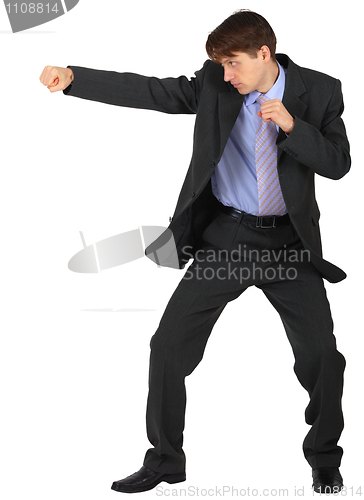Image of Businessman punching on white background