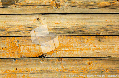 Image of Old battered wall are covered with boards