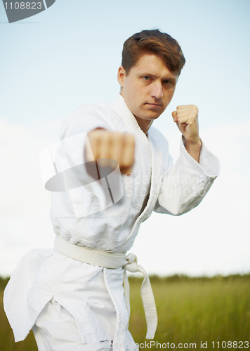 Image of Ðoung man is engaged in karate