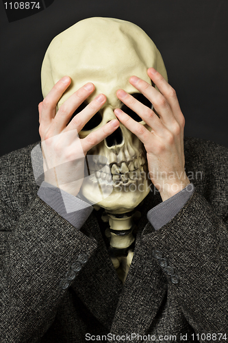 Image of Skeleton covering his eyes