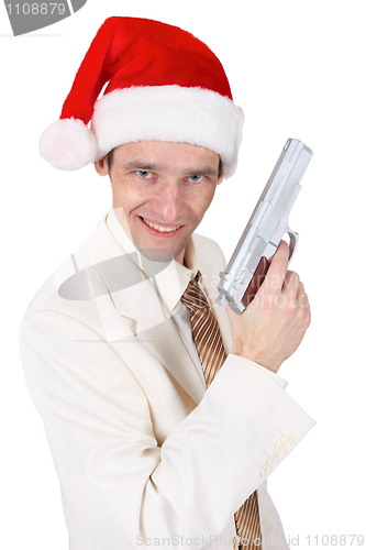 Image of Merry guy in Christmas hat with a gun