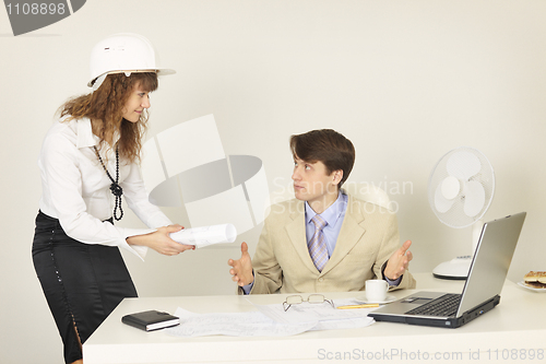 Image of Young businessmen on a workplace