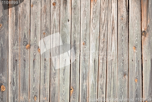 Image of Weathered wooden wall with stains and cracks