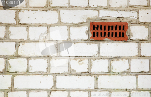 Image of Brick wall with primitive ventilation