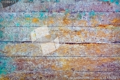 Image of Wall - rotten boards with colored stains