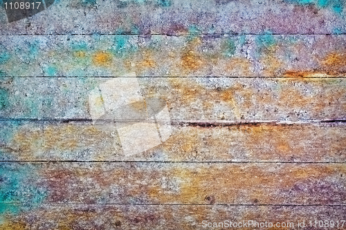 Image of Wall - rotten boards with colored stains