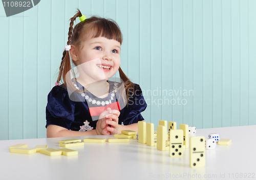 Image of Happy child playing with toys
