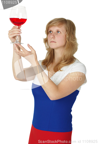 Image of Woman - taster checks color and opacity of wine