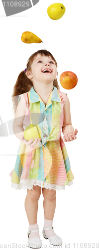 Image of Little funny girl juggles fruit