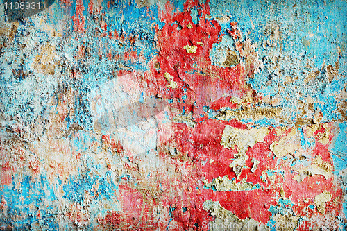 Image of Weathered paint different colors on old wall